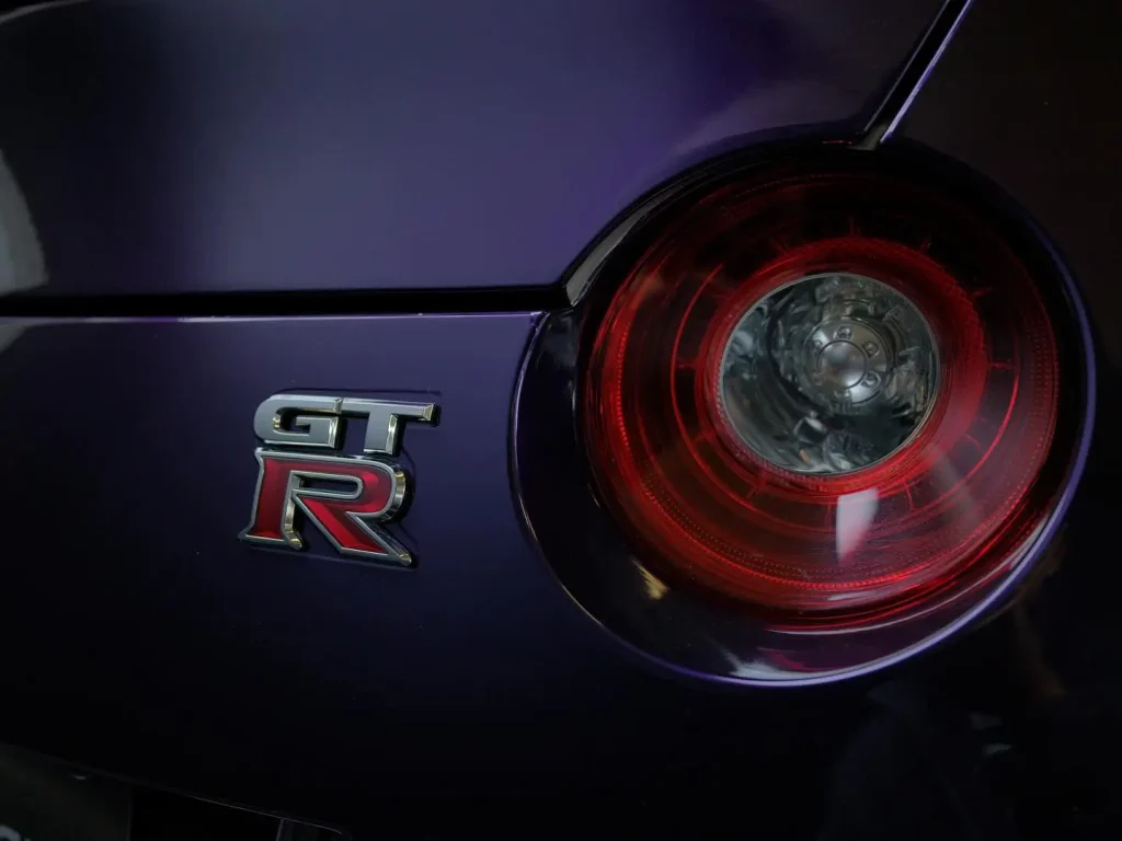 Car wraps Banksmeadow installation process showing midnight purple Inozetek vinyl application on luxury vehicle