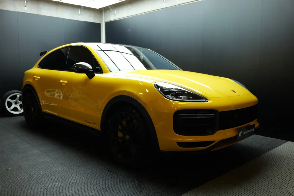 Yellow Porsche Cayenne Turbo GT with paint protection film and AX Dazzling Yellow vinyl wrap
