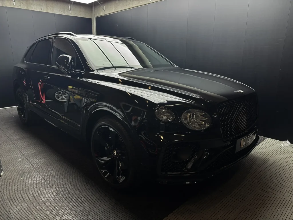 Black Bentley Bentayga with full paint protection film at Sydney car detailing workshop specialising in graphene coating services