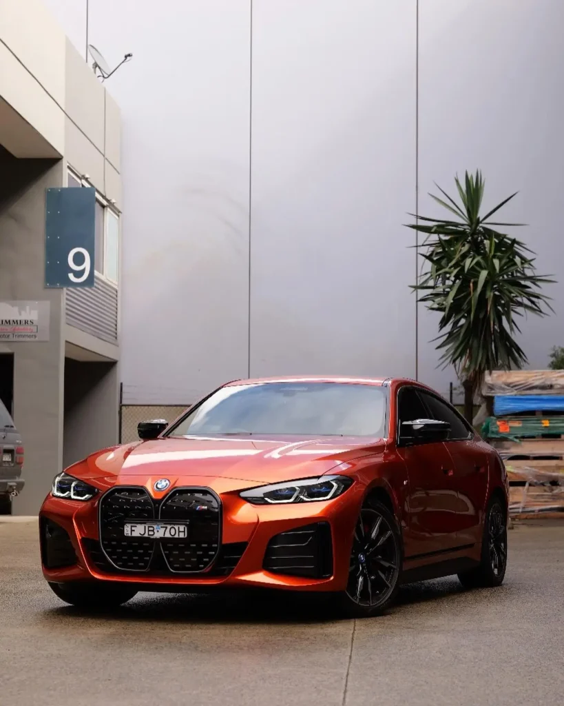 BMW i4 metallic copper wrap transformation premium finish automotive protection Sydney